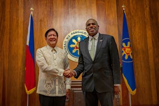 Philippine president Ferdinand Marcos Jr and British foreign minister David Lammy shake hands as they pose for pictures at the Malacanang Palace in Manila, Philippines, on Saturday